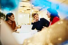 group conversation in a boardroom